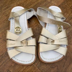 Brand new girls Salt Water sandals. Gold. Size 2